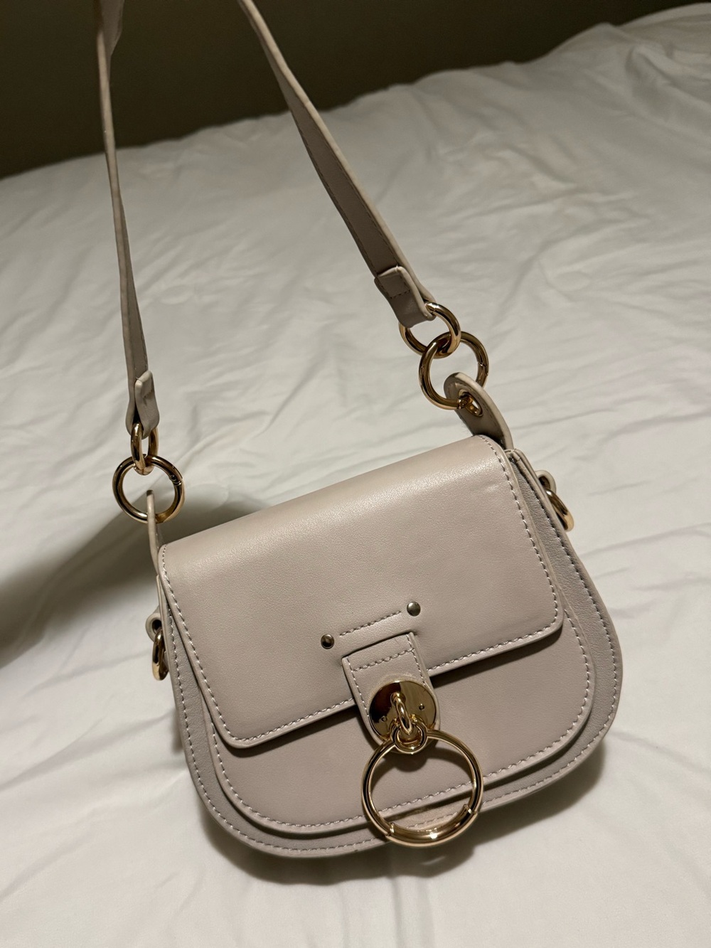Classic Cream Crossbody Bag with Gold Ring Accent